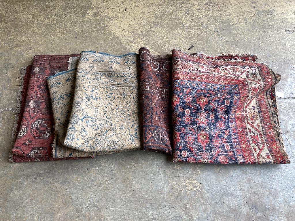 Four worn Persian rugs, largest 190 x 133cm